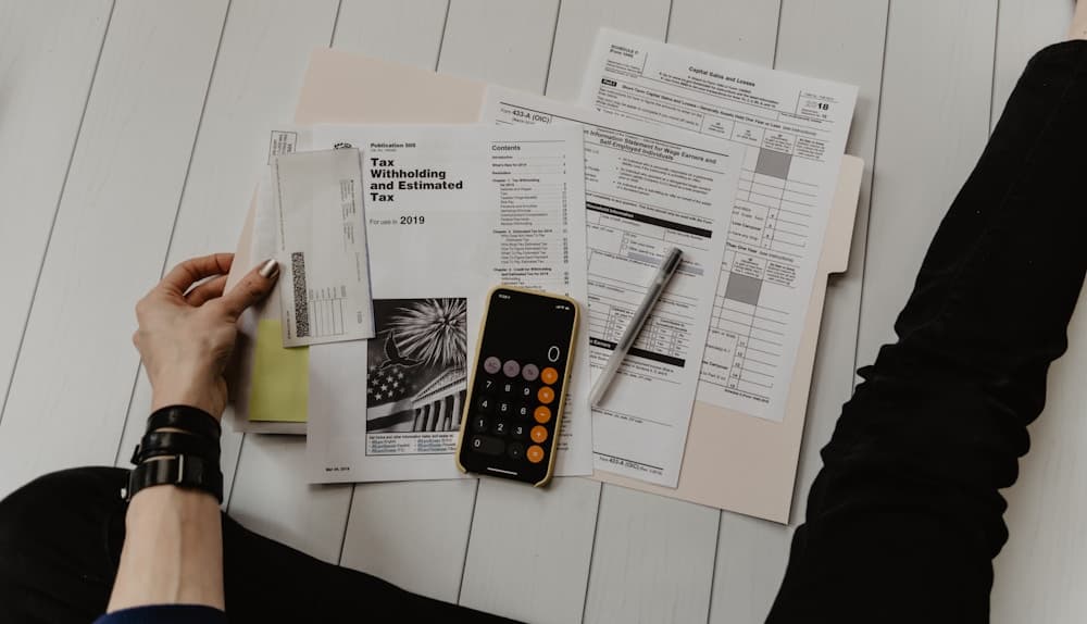 Visa application documents and paperwork on a desk